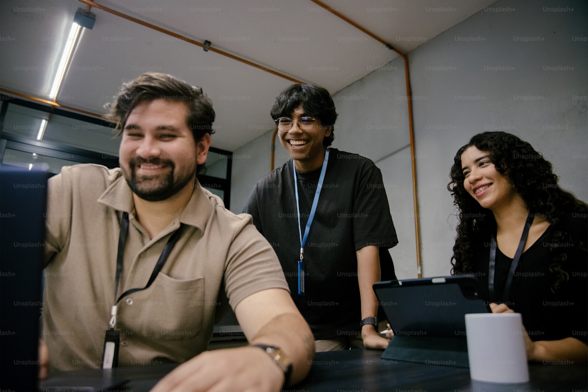 Team smiling and collaborating in a meeting room